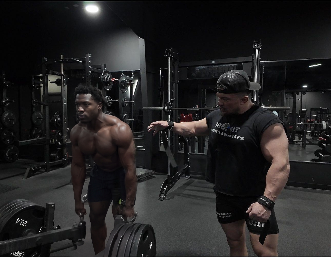 Patrick coaching a client through a heavy lift